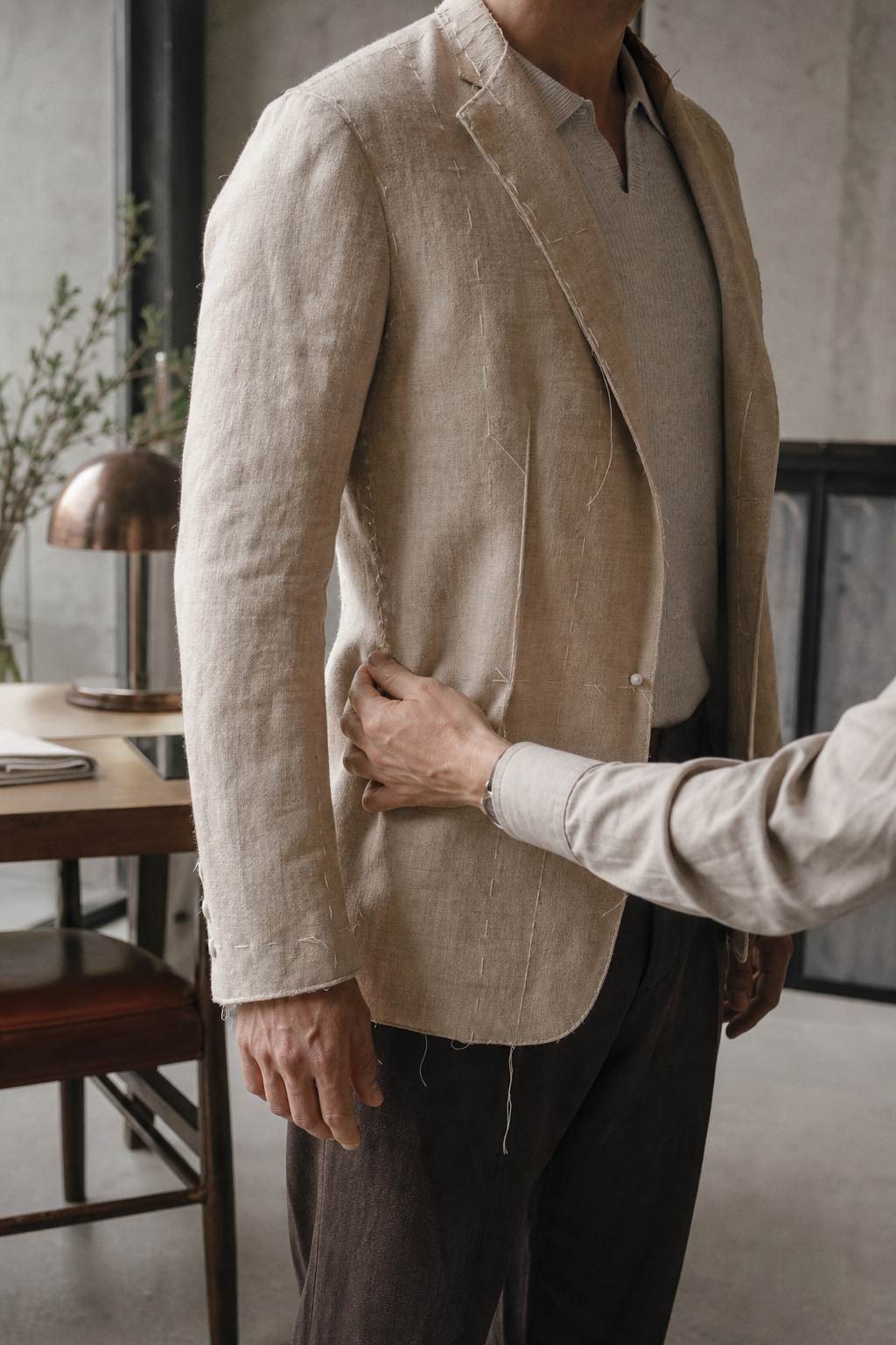 A linen toile being fitted